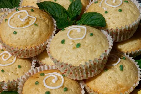 closeup of lemon muffins with mint ready to eatの写真素材