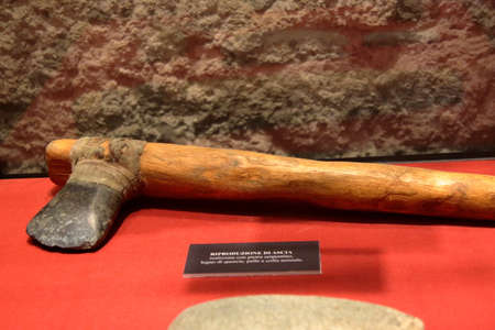 Archeological museum, La Spezia, Italy - summer 2020: Stone-tipped axe, Stone Age