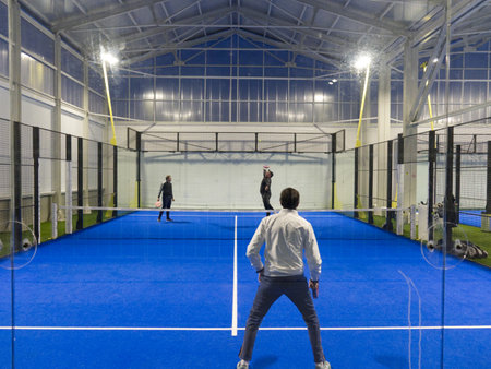 Bairo, Italy - december 2020: guys play padel in an indoor court.のeditorial素材