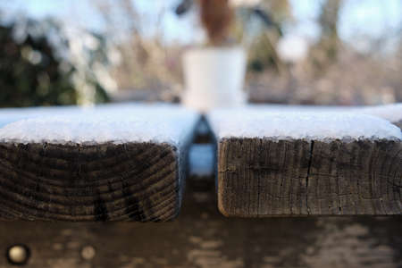 closeup of wooden planks covered with ice crystals during the winterの写真素材