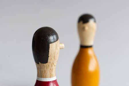 narrow countershot of a dialogue between two wooden puppets