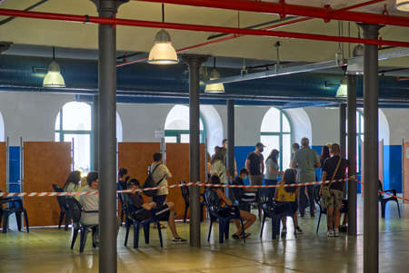 Italy: students queuing to receive the dose of anti-covid vaccine in a vaccination center before the start of schoolのeditorial素材
