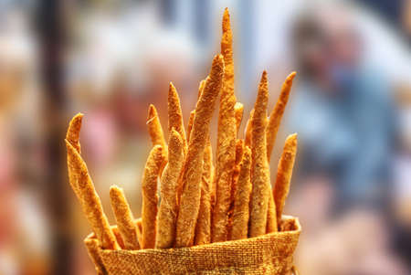 composition of artisanal breadsticks with semolina flourの写真素材