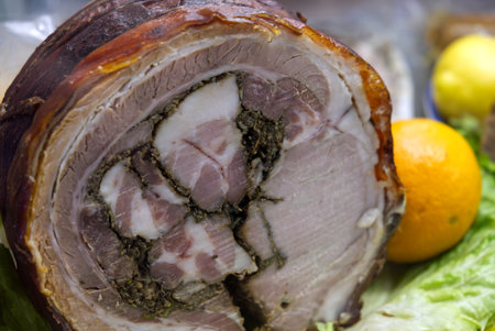Homemade Rolled Porchetta Roast, wooden plank,italian porchetta on a tray.の写真素材