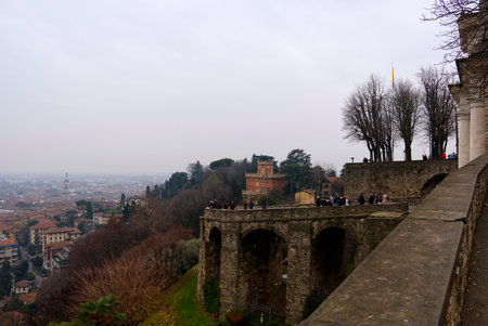 Bergamo, Italy - 15 jan 2023: tourists go up the historic access road to Bergamo Vecchiaのeditorial素材