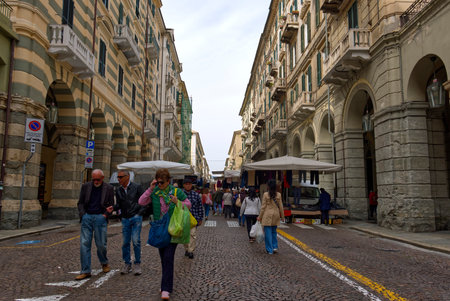 Savona, Italy - 7 apr 2024: the local market in the central Via Pietro Paleocapaのeditorial素材