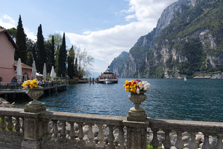 Lake Garda with mountains in background, view from Riva del Garda town shore, Italy, Europe.の写真素材