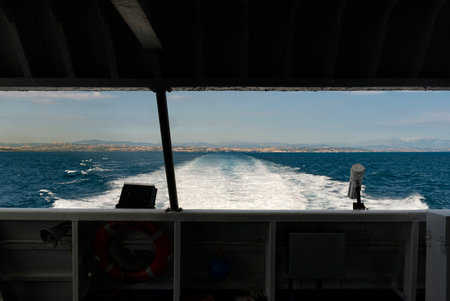 Trail on water surface behind of fast moving motor boatの写真素材