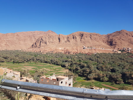 A beautiful view of a valley that features mountains in the backgroundの写真素材