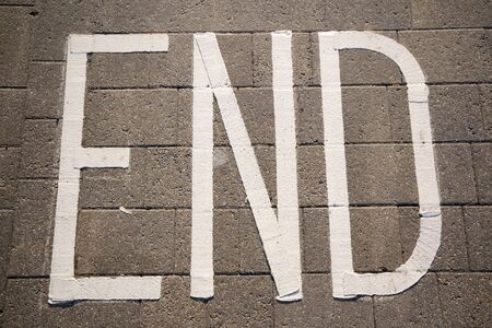 Word end written on the pavement