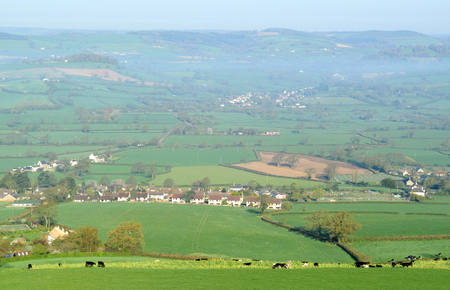 Panoramic view over Axe Valley, Devon on a foggy spring morning