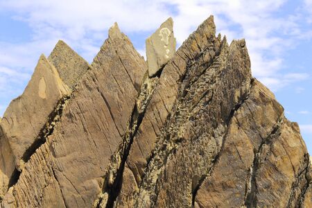 Rocks on the beach during low tide in seaside town of Ilfracombe on the North Devon coastの写真素材