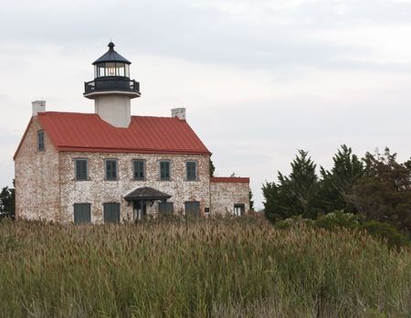 An old brick lighthouse on the Jersey shoreの写真素材