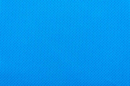 Smooth surface of a blue polyester sport t-shirt as background or textureの写真素材