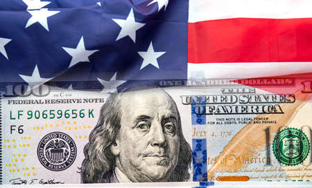 USA American flag and 100 dollars banknotes as background, concept picture about economyの写真素材