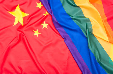 Natural fabric flag of China and LGBT Rainbow flag as texture or background, concept picture about human rightsの写真素材