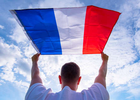 Man holding Flag of France, concept pictureの写真素材