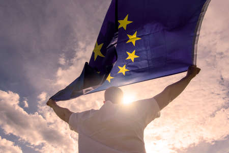 Man holding EU Flag or European Union flag, concept pictureの写真素材
