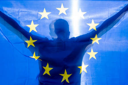 Man holding EU Flag or European Union flag, concept pictureの写真素材