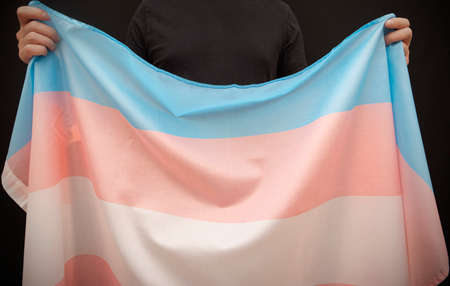 Anonymous person with Transgender Pride flag, concept pictureの写真素材