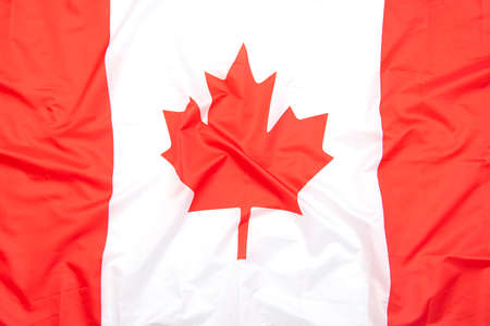 Real fabric flag of Canada as background or texture, top view, Canadian flagの写真素材