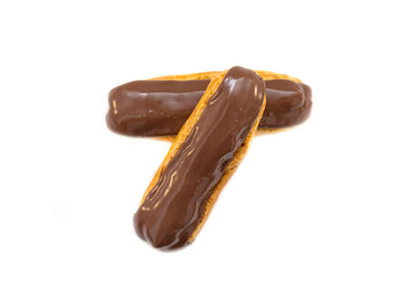 French Eclair with Chocolate brown Glaze. Eclairs with Custard isolated on white Background, top...
