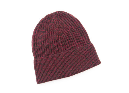 Knitted seasonal autumn winter hat isolated on whiteの写真素材