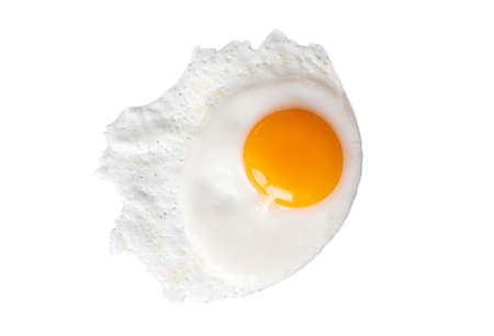 Real close-up fried egg with yellow yolk isolated on white background, top view, high resolutionの写真素材