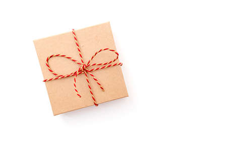 Paper gift box with ribbon isolated on white, lay out, space for textの写真素材