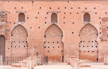 Ancient walls of medina in Marrakech, part of Kutubiyya mosque, arabian style of doors and windows, buildings by red clay, Moroccoの写真素材
