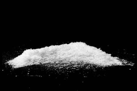 Snow heap, snowdrift isolated on black, snowy textureの写真素材