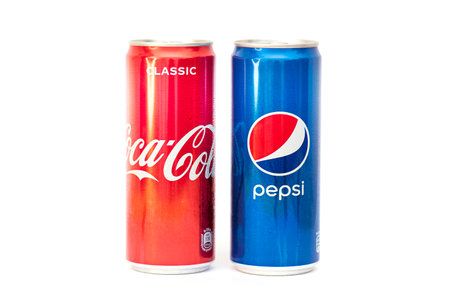 MOSCOW - JAN 15: Two cans with soft drinks Coca-Cola and Pepsi-Cola in new design isolated on white in Moscow, January 15.2021 in Russiaのeditorial素材