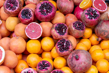 Pomegranates, oranges, grapefruits on the counter of street market in Istanbul, Turkeyの写真素材