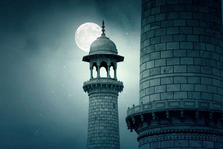 Minarets of Taj Mahal in the Night Time with Moon and Stars in Agra Indiaの写真素材