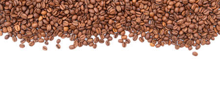 Row of roasted coffee beans isolated on white background. Top view, high resolution.の写真素材