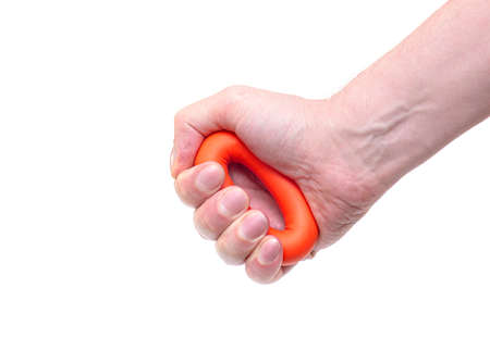 Hand with rubber Expander, Man compressing by Hand ring Expander isolated in white Backgroundの写真素材