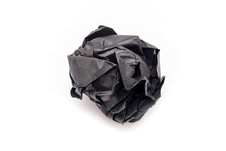 Real Black Paper crumpled as Ball, wrinkled paper texture, isolated on white Backgroundの写真素材