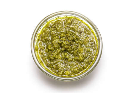 Top View of Italian Sauce Pesto or bowl of Basil Pesto isolated on white Backgroundの写真素材