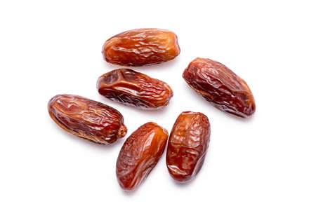 Top view of natural sweet Dates isolated on white Backgroundの写真素材