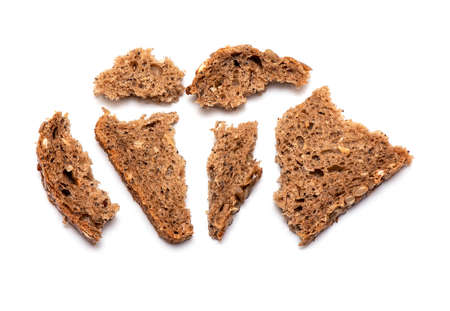 Top view of crumbled multi Grain brown Bread isolated on white Backgroundの写真素材