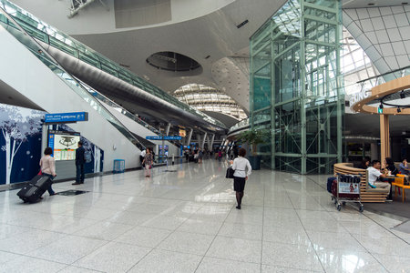 SEOUL - SEP 24: Interior of Seoul Incheon International Airport with passengers in Seoul, 24.09.2016 in South Korea.のeditorial素材