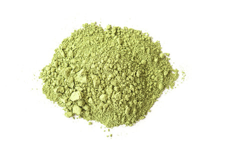 Powder of dry green Matcha tea isolated on white, top viewの写真素材