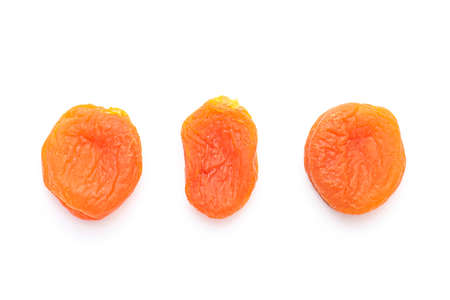 Dried apricots isolated on white, top viewの写真素材