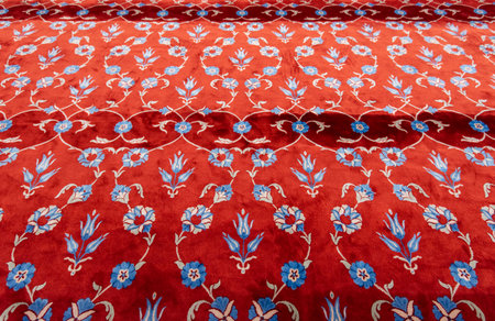 Part of red carpet or rug in muslim mosque. Prayer mat in the Blue Mosque in Istanbulの写真素材