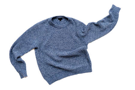 Blue sweater isolated on white, casual vintage knitted sweater, wool cardigan, top viewの写真素材