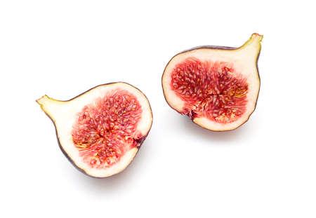 Two pieces, slices of ripple figs isolated on white, top view, space for textの写真素材