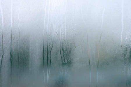 Window with condensate or steam after heavy rain, large texture or backgroundの写真素材