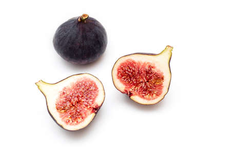 Pieces, slices of ripple figs isolated on white, top view, space for text