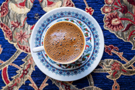 Traditional Turkish coffee, Anatolian coffee, on the table at the old cafe in Turkey. Top view.の写真素材