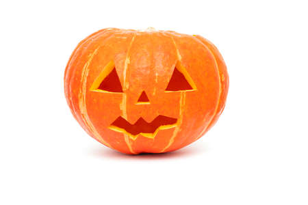 Halloween pumpkin, vibrant orange halloween pumpkin with scary face isolated on whiteの写真素材